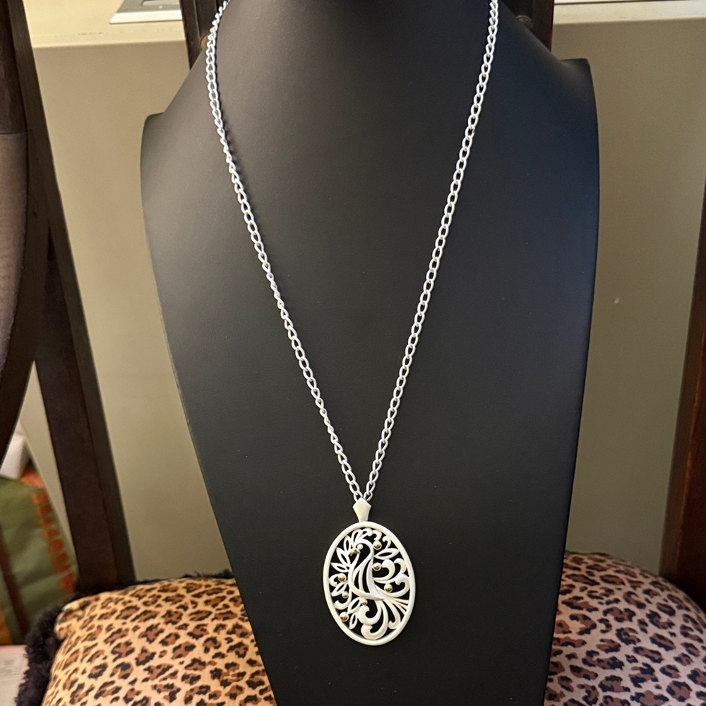 Vintage Monet White Gold Plated Necklace with Intricate Oval Bird Pendant.